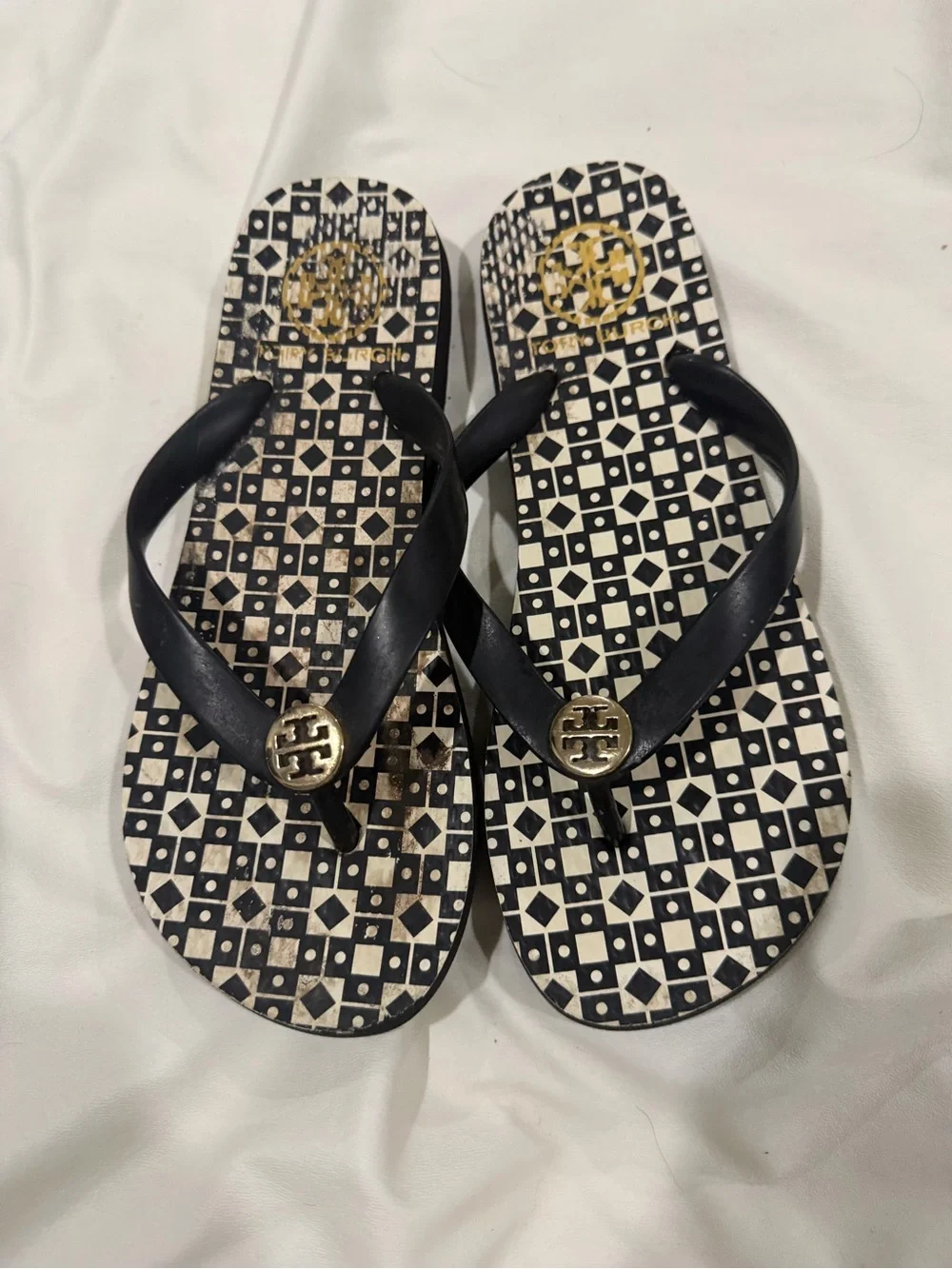 Tory Burch Black Strap Geometric Printed Flip Flops with Gold Medallions